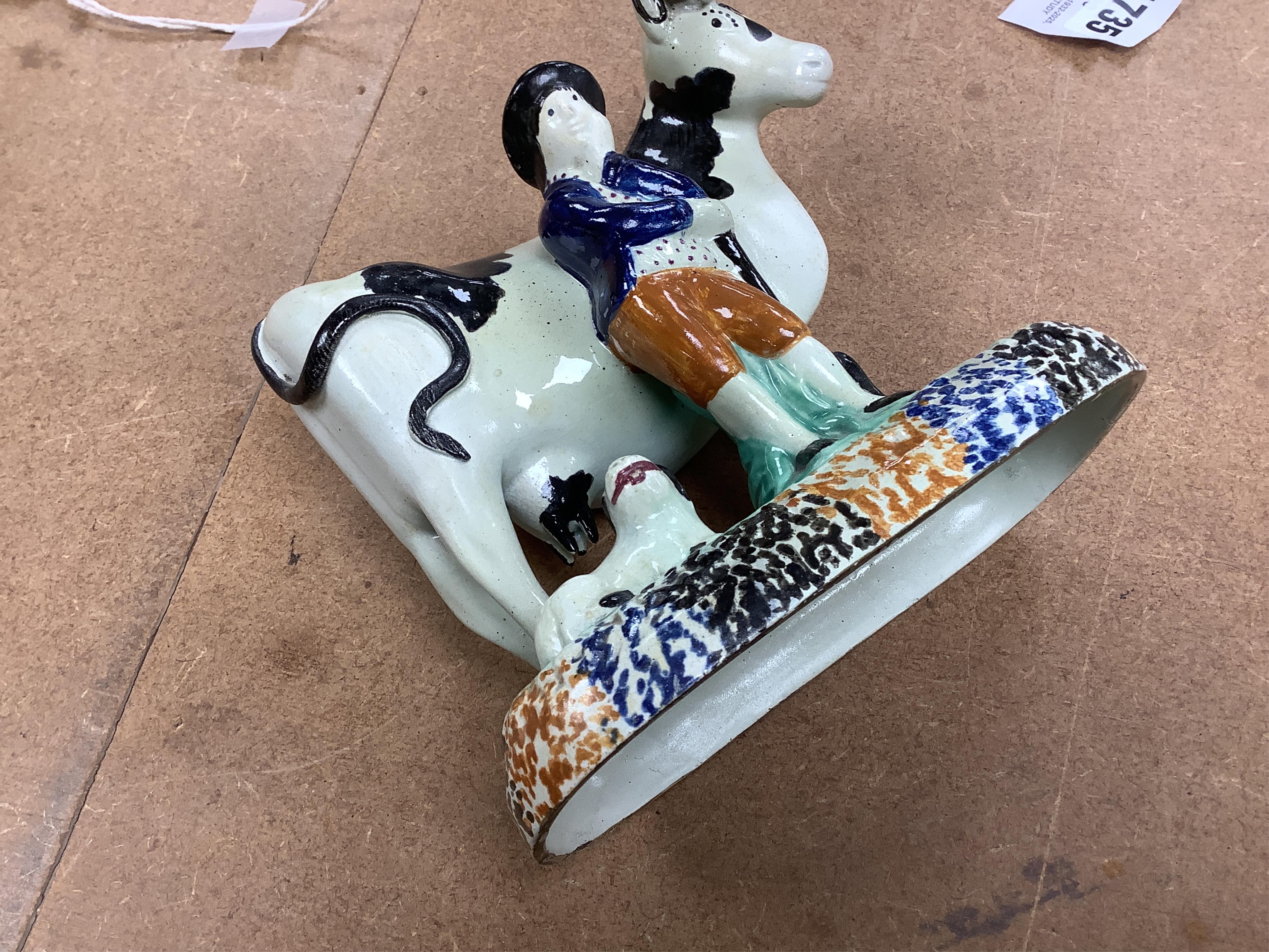 Two Yorkshire Prattware cows, with farmer or milkmaid and dog groups, c.1810